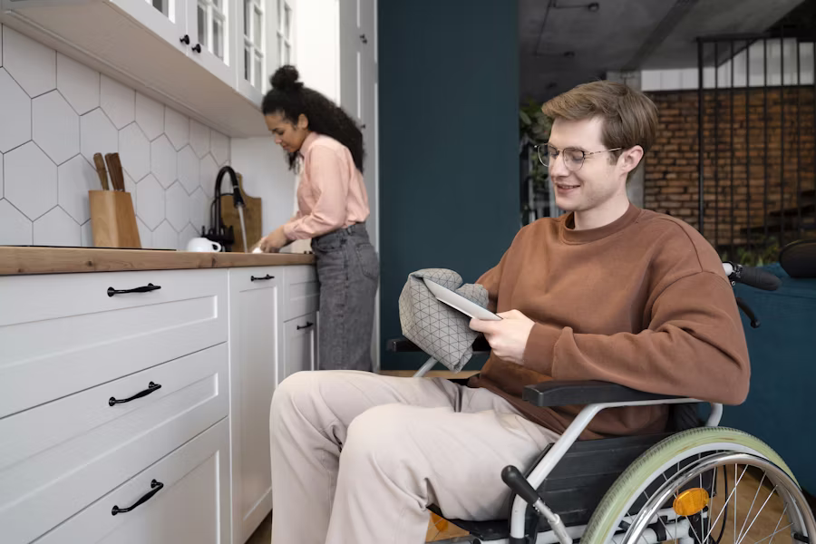 A caregiver gently supporting a person with a disability — heartwarming in-home disability care in Calgary